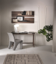 Writing desk with solid walnut-stained ash structure and mocha-colored glass top.