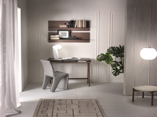 Writing desk with solid walnut-stained ash structure and mocha-colored glass top.