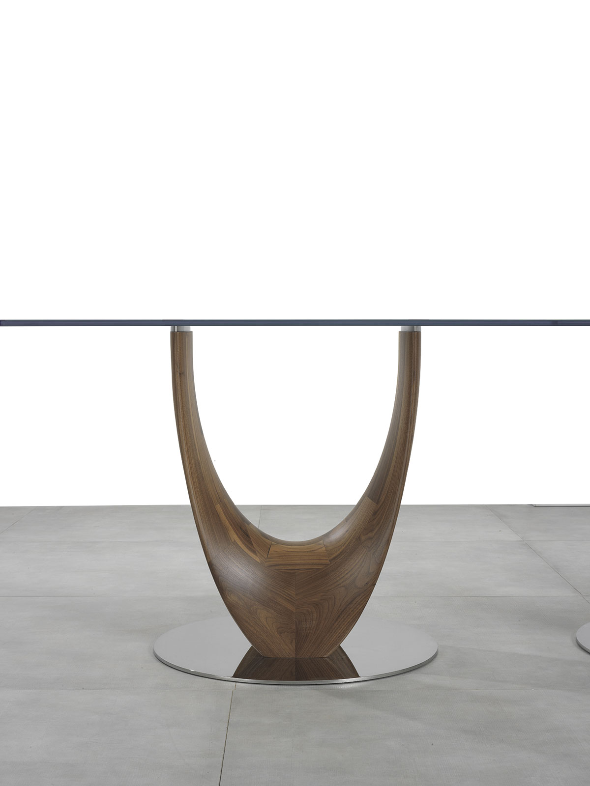 Round table designed by Stefano Bigi. Glass top. Walnut wood base. Available for online shopping. Free delivery.