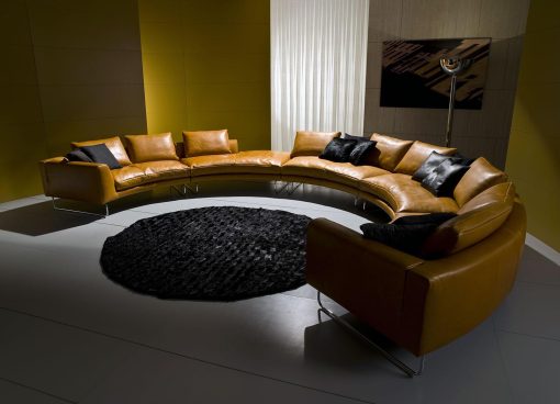 Add-Look Round is a luxurious sofa designed by Mauro Lipparini. This round leather sofa with solid wood frame, goose feathers padding and leather covering is perfect for any room.