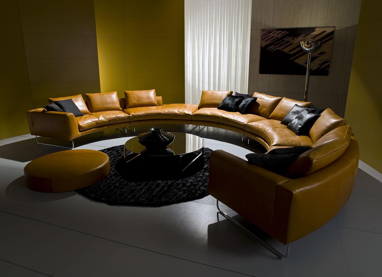 Add-Look Round is a luxurious sofa designed by Mauro Lipparini. This round leather sofa with solid wood frame, goose feathers padding and leather covering is perfect for any room.