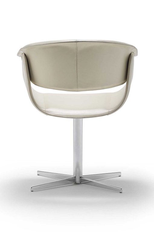 Luxurious swivel leather armchair designed by Noé Duchaufour Lawrance. Ivory colour and shiny chrome cross-shaped base (customizable). Worldwide delivery.