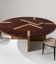 Refinement without ostentation. Great diameter round table with inlaid wood top. Lazy Susan flush with the top. 2 kinds of wood of your choice. Made in Italy