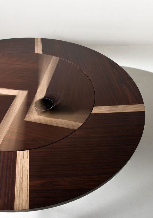 Refinement without ostentation. Great diameter round table with inlaid wood top. Lazy Susan flush with the top. 2 kinds of wood of your choice. Made in Italy