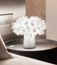 It looks like a modern flower bouquet. Adriano Rachele designed an original white table lamp by the unique features. Made in Italy with recyclable materials