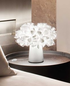 It looks like a modern flower bouquet. Adriano Rachele designed an original white table lamp by the unique features. Made in Italy with recyclable materials