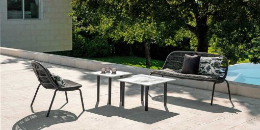 Original grey outdoor love seat designed by L+R Palomba and handcrafted with aluminium and an interweaving of synthetic rope. Online shopping, home delivery