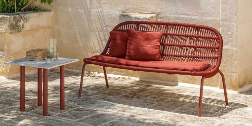 A wonderful red outdoor love seat sofa designed by Ludovica + Roberto Palomba. Aluminium frame and intertwined synthetic ropes. Free home delivery.