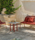 A wonderful red outdoor love seat sofa designed by Ludovica + Roberto Palomba. Aluminium frame and intertwined synthetic ropes. Free home delivery.