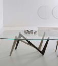 La table rectangulaire Edge a les pieds bicolore bronze et titane et le plan en verre transparent extra clair trempé de dim. cm. 110 x 220 ou 120 x 240.