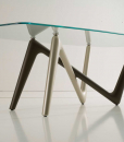 Unusual legs intersection in bronze and titanium colour and extra clear safety glass cm. 110 x 220 or 120 x 240. Edge luxurious original rectangular table.