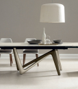 Andrea Lucatello designed a high-end ceramic extensible table, customizable in several finishing. Bicolor base, aluminium frame and barrel-shaped top.