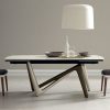 Andrea Lucatello designed a high-end ceramic extensible table, customizable in several finishing. Bicolor base, aluminium frame and barrel-shaped top.