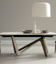 Andrea Lucatello designed a high-end ceramic extensible table, customizable in several finishing. Bicolor base, aluminium frame and barrel-shaped top.