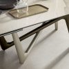Andrea Lucatello designed a high-end ceramic extensible table, customizable in several finishing. Bicolor base, aluminium frame and barrel-shaped top.