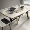 Andrea Lucatello designed a high-end ceramic extensible table, customizable in several finishing. Bicolor base, aluminium frame and barrel-shaped top.