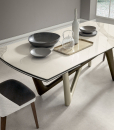 Andrea Lucatello designed a high-end ceramic extensible table, customizable in several finishing. Bicolor base, aluminium frame and barrel-shaped top.