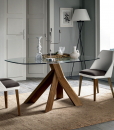 Want to make your living room look more elegant? Opt for a glass table with walnut wood frame made in Italy combining traditional crafts with modern design.