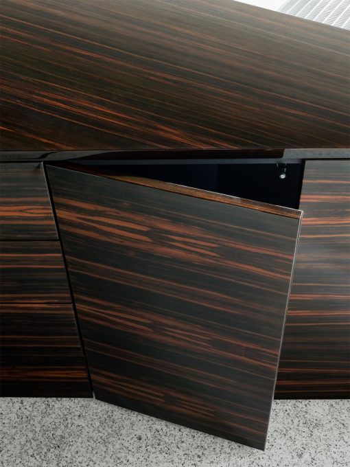 Luxurious and very original executive desk in ebony wood and leather covering. Ferruccio Laviani design, made in Italy. Worldwide delivery office furniture.