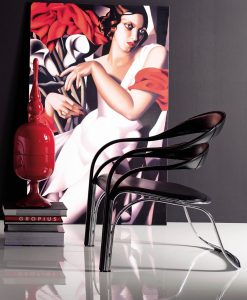 Poltrona lounge di Vladimir Kagan. Struttura in acciaio e rivestimento in cuoio pieno fiore. Colore e finiture personalizzabili. Consegna gratuita.