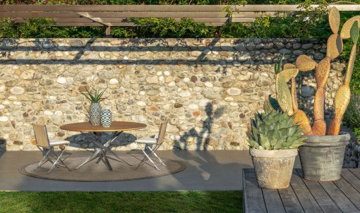 Ludovica and Roberto Palomba designed a luxurious and original outdoor round table. Accoya wood top and stainless steel base. Online shop and free delivery.