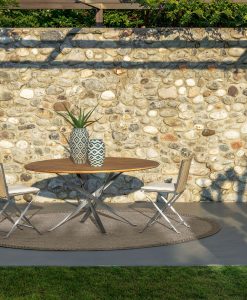 Ludovica and Roberto Palomba designed a luxurious and original outdoor round table. Accoya wood top and stainless steel base. Online shop and free delivery.