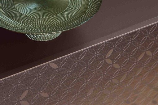 Giove lacquered sideboard with 3D decoration in bronze metallic finish.
