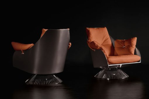 Le fauteuil tournant orange Gloss est dessiné par Giuseppe Viganò et réalisé avec les meilleurs cuirs. Structure en bois, pied en métal. Livraison offerte.