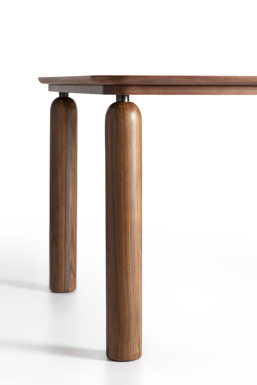 Detail of the round legs in canaletto walnut of the GO table