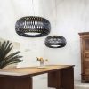 Art of weaving and technical performance. A round scenographic black pendant lamp designed by Elisa Giovannoni. Worldwide home delivery.