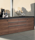 The 4 units low cabinet in walnut and leather is part of the Kefa collection by Matteo Nunziati for the office and is also perfect for an exclusive home.