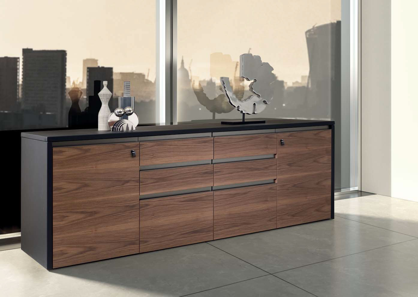 The 4 units low cabinet in walnut and leather is part of the Kefa collection by Matteo Nunziati for the office and is also perfect for an exclusive home.