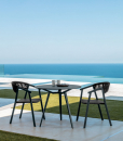 Charcoal grey and black are the dark colours of this beautiful outdoor armchair perfect for a dining table. Luxurious furniture with home delivery.