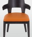 Padded chair in wood with armrests. Covering in velvet or in soft leather. Many colours available. Online shopping and home delivery. Made in Italy.