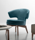 Lolita small armchair in petrol blue leather has a walnut base and can be shipped for free. Ideal for use at home or in a luxurious office. Online shopping