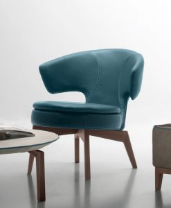 Lolita small armchair in petrol blue leather has a walnut base and can be shipped for free. Ideal for use at home or in a luxurious office. Online shopping