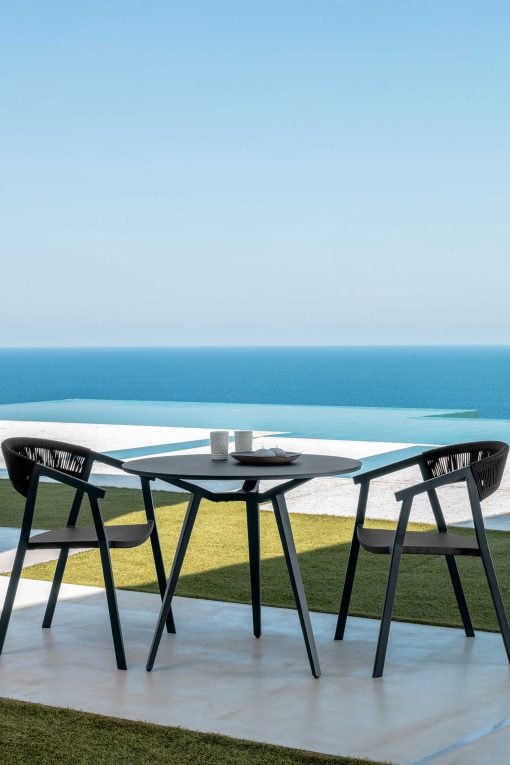 Margot is a small and solid round outdoor table designed by Marco Acerbis. White or grey colours at choice, diameter cm. 90. Online shopping.