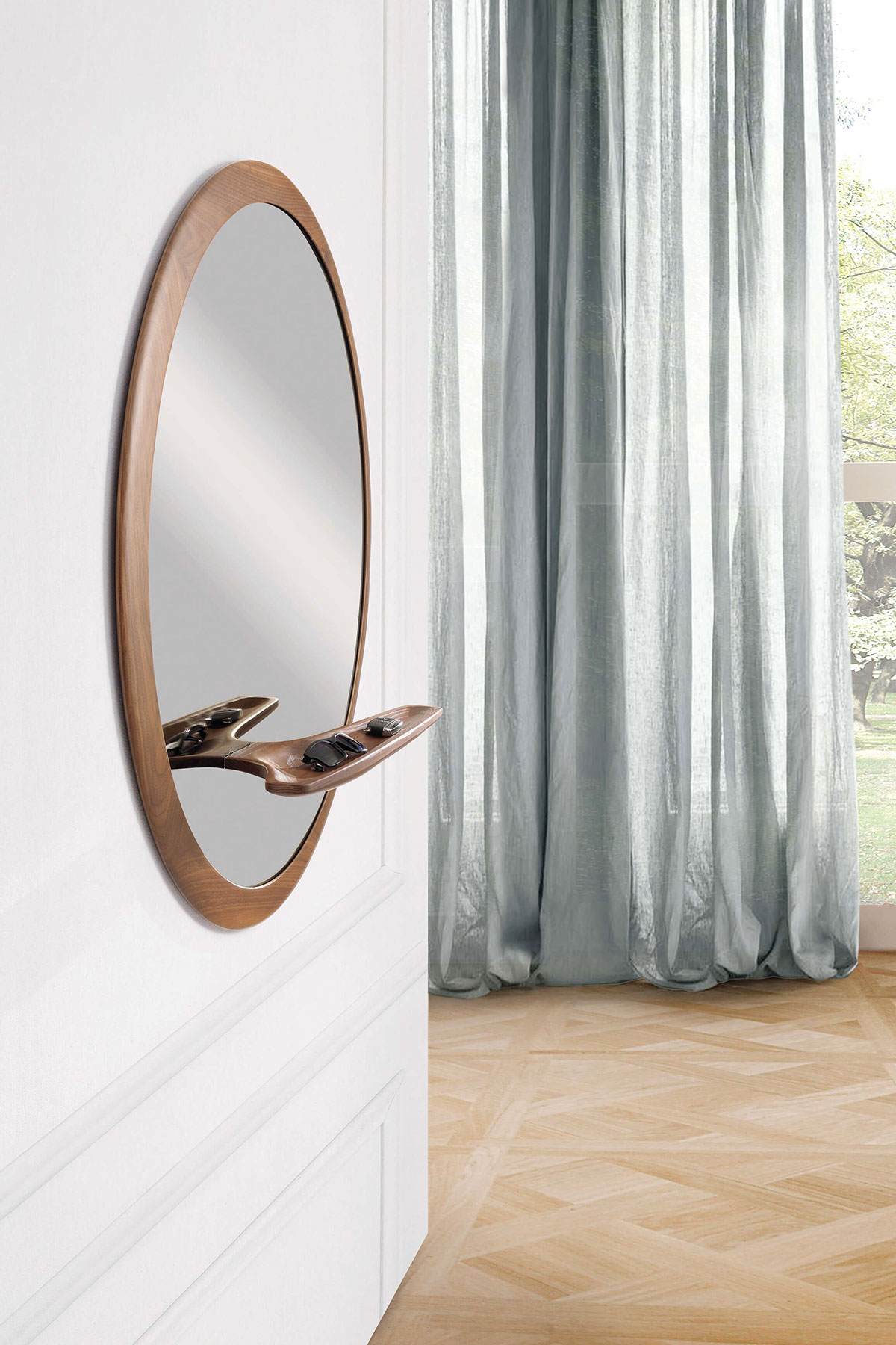 MIRAGGIO is an elegant and refined round mirror with American walnut and clear or bronzed glass. Little shelf included. Made in Italy, free delivery.