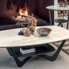 Ceramic top in Calacatta Gold finish and metal base. This modern coffee table also has an additional shelf. Its legs are graphite painted. Online shopping.