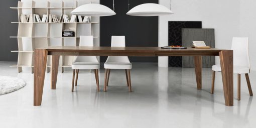 Pulse is an extendable wood dining table designed by Arter & Citton. The graceful curves and designs of this modern dining table are created to add elegance to any room.