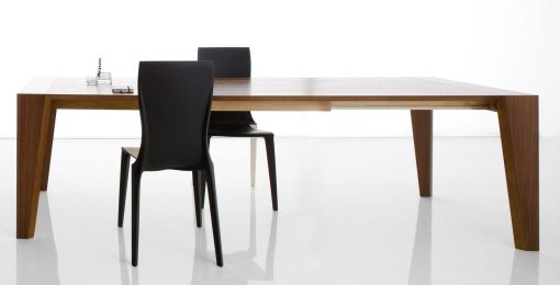 Pulse is an extendable wood dining table designed by Arter & Citton. The graceful curves and designs of this modern dining table are created to add elegance to any room.