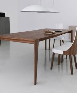 Pulse is an extendable wood dining table designed by Arter & Citton. The graceful curves and designs of this modern dining table are created to add elegance to any room.