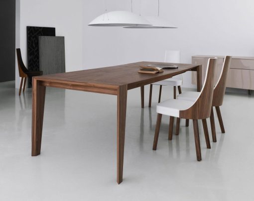 Pulse is an extendable wood dining table designed by Arter & Citton. The graceful curves and designs of this modern dining table are created to add elegance to any room.