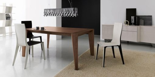 Pulse is an extendable wood dining table designed by Arter & Citton. The graceful curves and designs of this modern dining table are created to add elegance to any room.