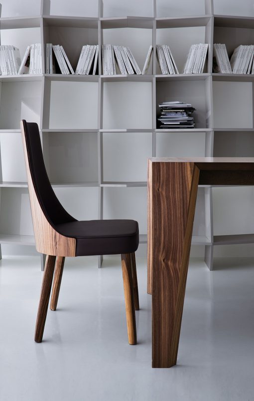 Pulse is an extendable wood dining table designed by Arter & Citton. The graceful curves and designs of this modern dining table are created to add elegance to any room.