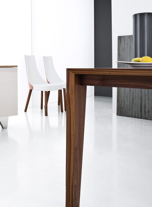 Pulse is an extendable wood dining table designed by Arter & Citton. The graceful curves and designs of this modern dining table are created to add elegance to any room.