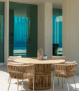 The designers Ludovica and Roberto Palombo created a refined and luxurious outdoor round table with aluminium frame and synthetic fabric ropes weaving.