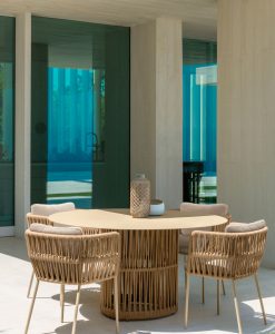 The designers Ludovica and Roberto Palombo created a refined and luxurious outdoor round table with aluminium frame and synthetic fabric ropes weaving.