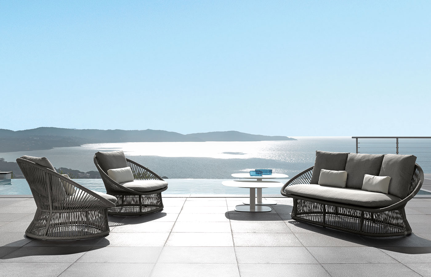 Garden furniture for luxurious villas, yachts, hotels. Outdoor sofa in a grey aluminium frame and weave fabric. Online shopping and free delivery.