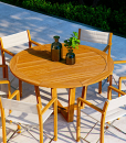 Luxury outdoor round table. Solid Asian teak wood. Luxury furniture for garden and terrace. Online sale.